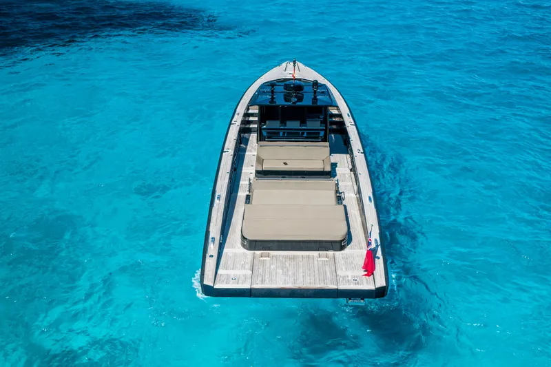 Dragon Yacht Photos Pics Luxury 2017 Windy SR52 Blackbird yacht on clear turquoise water.