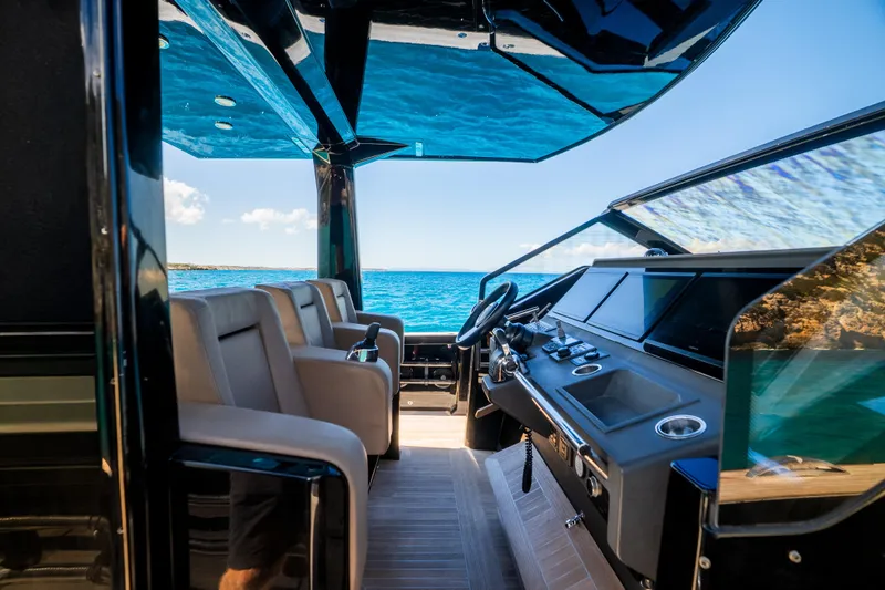 Dragon Yacht Photos Pics Luxurious 2017 Windy SR52 Blackbird yacht interior with ocean view and modern cockpit.