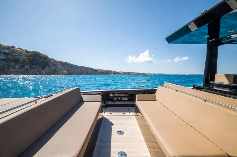 Dragon Yacht Photos Pics Luxurious 2017 Windy SR52 Blackbird yacht with spacious seating, cruising on clear blue waters.