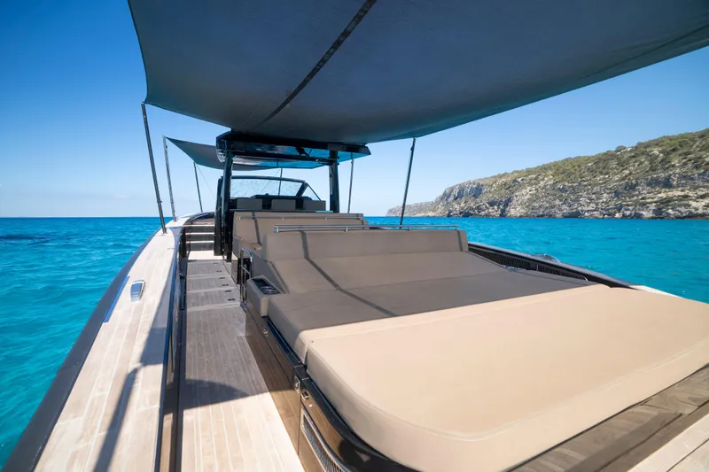 Dragon Yacht Photos Pics Luxurious 2017 Windy SR52 Blackbird yacht on clear blue waters, featuring spacious sunbeds.