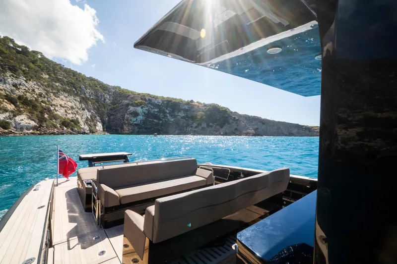 Dragon Yacht Photos Pics Luxurious 2017 Windy SR52 Blackbird yacht cruising in scenic coastal waters.