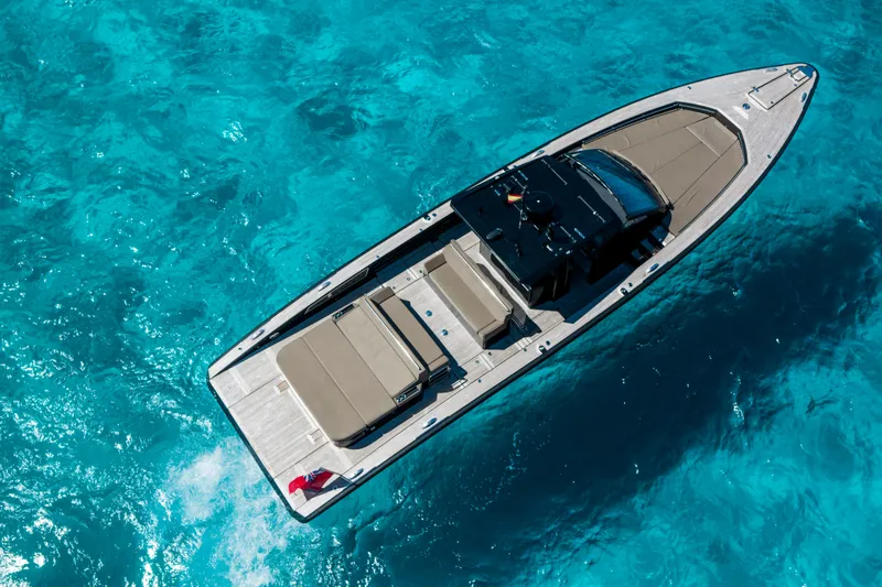 Dragon Yacht Photos Pics Aerial view of 2017 Windy SR52 Blackbird yacht on clear blue water.