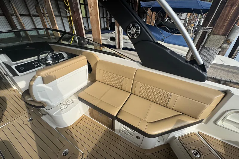  Yacht Photos Pics 2021 Sea Ray SLX 280 boat interior with tan seating and modern dashboard.