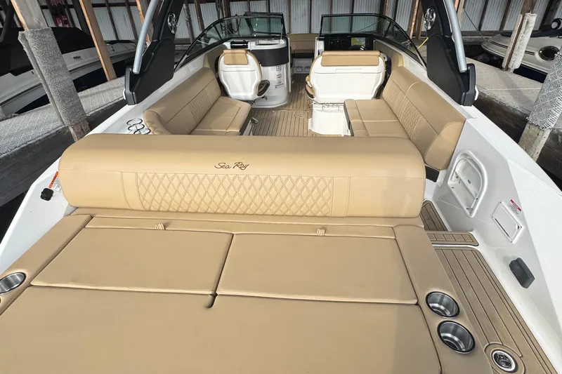  Yacht Photos Pics Luxurious interior of 2021 Sea Ray SLX 280 boat with beige seating and cup holders.