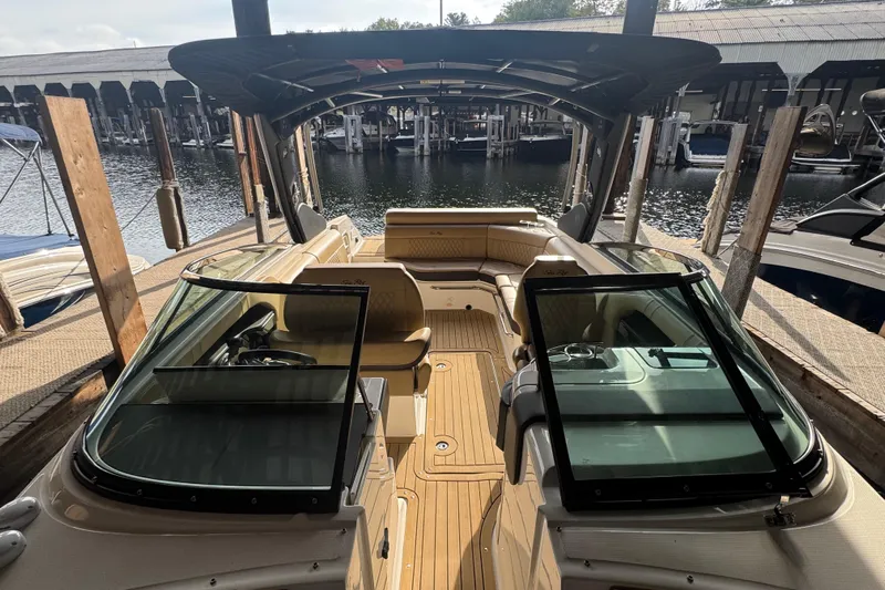  Yacht Photos Pics 2021 Sea Ray SLX 280 boat docked, featuring spacious seating and sleek design.