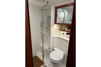 Luxurious bathroom in 2022 Nimbus 405 Coupé yacht with shower and toilet.