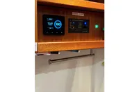 Control panel of 2022 Nimbus 405 Coupé, featuring digital displays and settings.