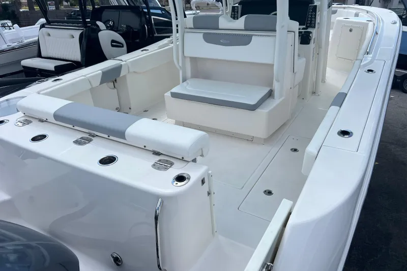  Yacht Photos Pics 2020 Robalo R302 Center Console boat interior with seating and console features.