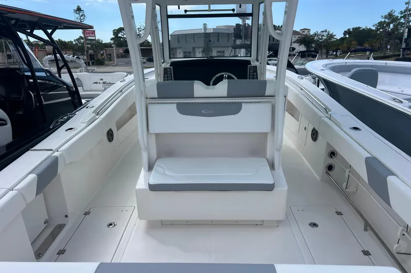  Yacht Photos Pics 2020 Robalo R302 Center Console boat interior with seating and helm station.