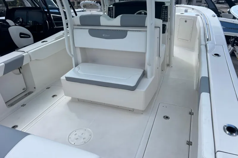  Yacht Photos Pics 2020 Robalo R302 Center Console boat interior with seating and console area.