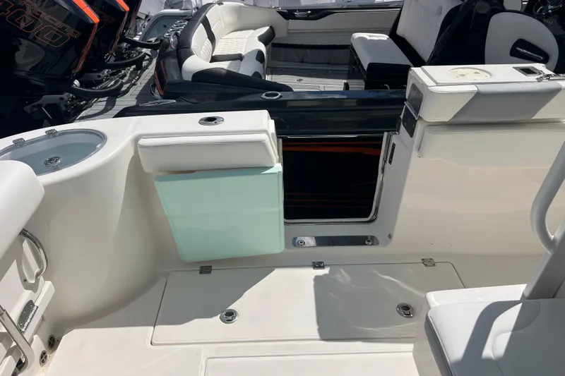  Yacht Photos Pics 2020 Robalo R302 Center Console boat interior with seating and storage compartments.