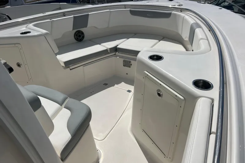  Yacht Photos Pics 2020 Robalo R302 Center Console boat interior with cushioned seating and cup holders.