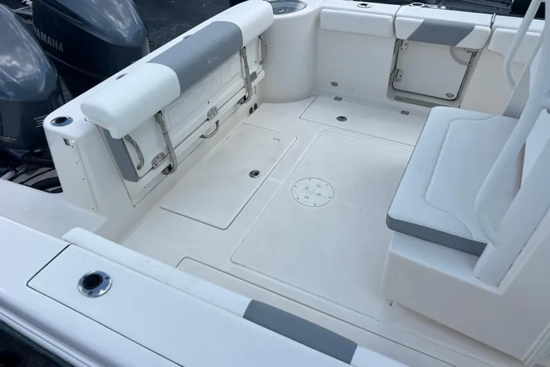  Yacht Photos Pics 2020 Robalo R302 Center Console boat interior with seating and storage compartments.