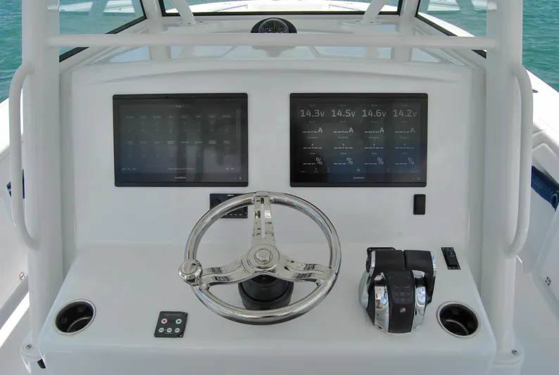  Yacht Photos Pics 2022 Yellowfin 39 Offshore helm with dual displays and steering wheel.