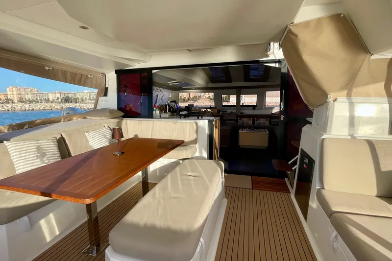 Cabalito De Mar Yacht Photos Pics 2024 Fountaine Pajot Catamaran Elba 45 interior with elegant seating and dining area.