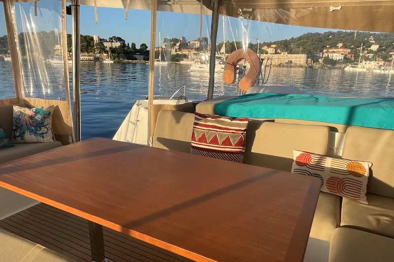 Cabalito De Mar Yacht Photos Pics Luxurious 2024 Fountaine Pajot Catamaran Elba 45 interior with scenic waterfront view.