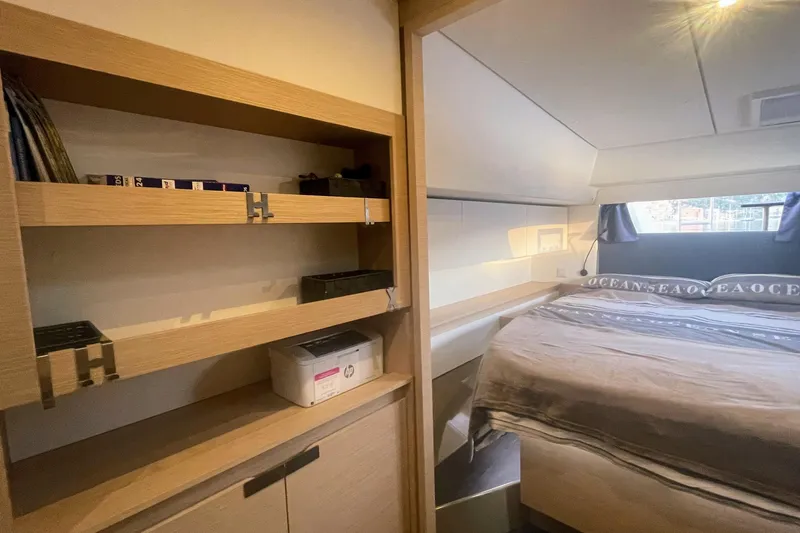 Cabalito De Mar Yacht Photos Pics 2024 Fountaine Pajot Catamaran Elba 45 interior cabin with bed and shelving.