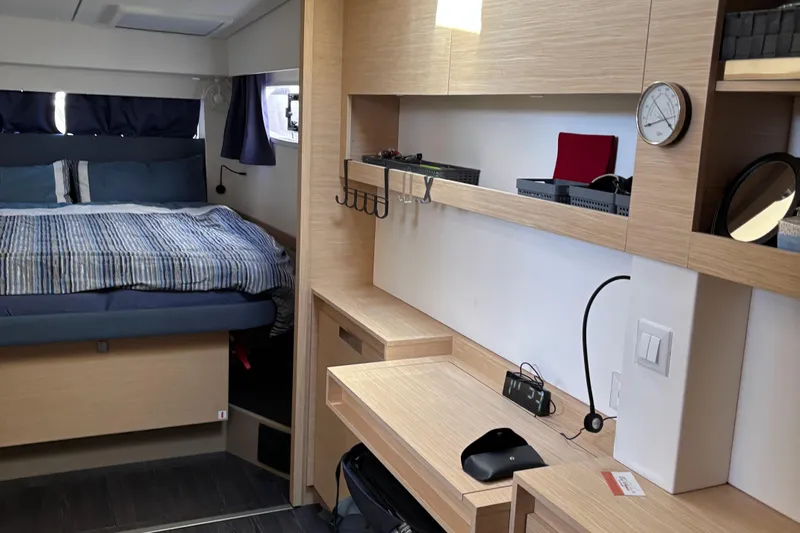 Cabalito De Mar Yacht Photos Pics 2024 Fountaine Pajot Catamaran Elba 45 interior cabin with bed and desk area.