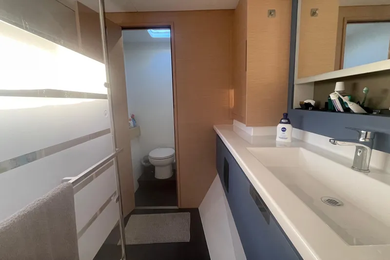 Cabalito De Mar Yacht Photos Pics Modern bathroom interior of 2024 Fountaine Pajot Catamaran Elba 45, featuring sleek design elements.