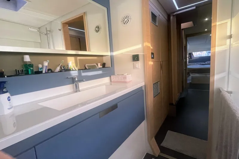 Cabalito De Mar Yacht Photos Pics Modern bathroom interior of 2024 Fountaine Pajot Catamaran Elba 45, featuring sleek design and amenities.