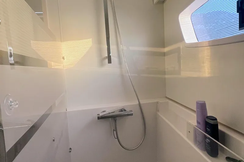 Cabalito De Mar Yacht Photos Pics Bathroom interior of 2024 Fountaine Pajot Catamaran Elba 45 with shower and window.