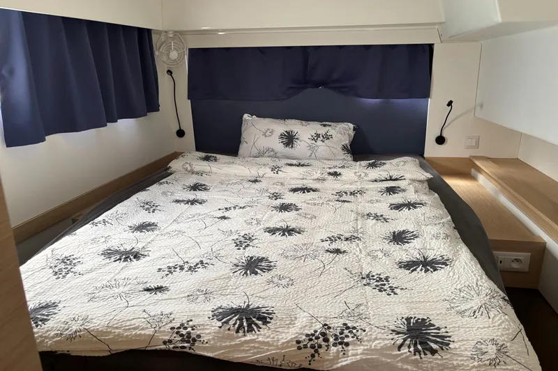 Cabalito De Mar Yacht Photos Pics Cozy bedroom in 2024 Fountaine Pajot Catamaran Elba 45 with floral bedding.