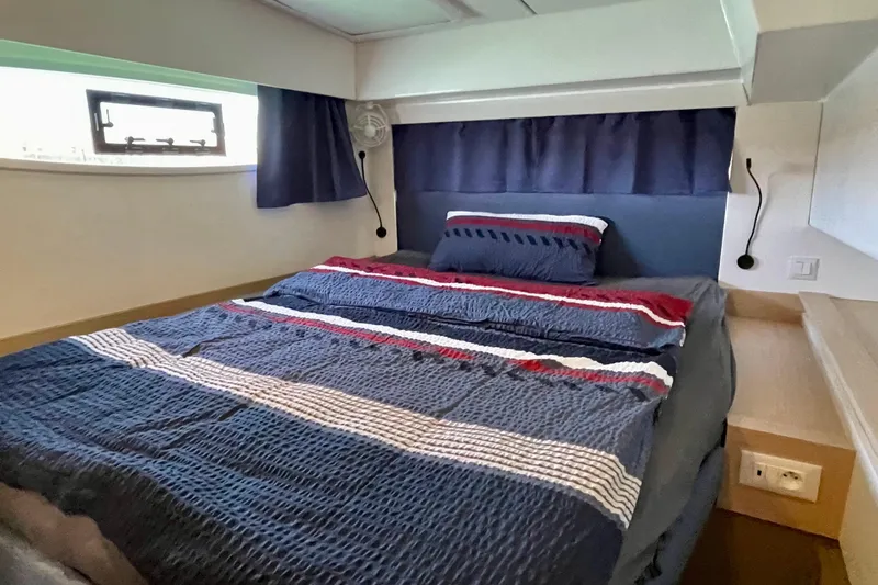 Cabalito De Mar Yacht Photos Pics 2024 Fountaine Pajot Catamaran Elba 45 cabin with cozy bed and nautical decor.