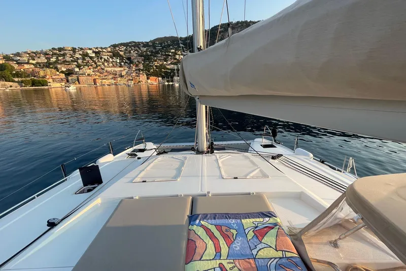 Cabalito De Mar Yacht Photos Pics 2024 Fountaine Pajot Catamaran Elba 45 on serene water with scenic coastal backdrop.