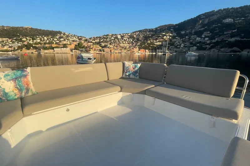 Cabalito De Mar Yacht Photos Pics 2024 Fountaine Pajot Catamaran Elba 45 with spacious seating, scenic coastal backdrop.