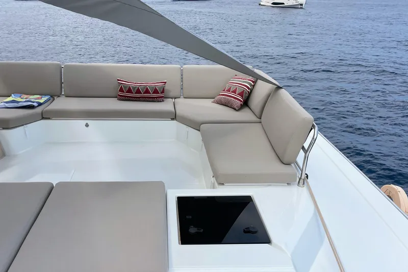 Cabalito De Mar Yacht Photos Pics 2024 Fountaine Pajot Catamaran Elba 45 deck with cushioned seating and decorative pillows.