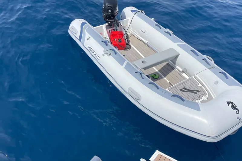 Cabalito De Mar Yacht Photos Pics Inflatable boat on blue water, associated with 2024 Fountaine Pajot Catamaran Elba 45.