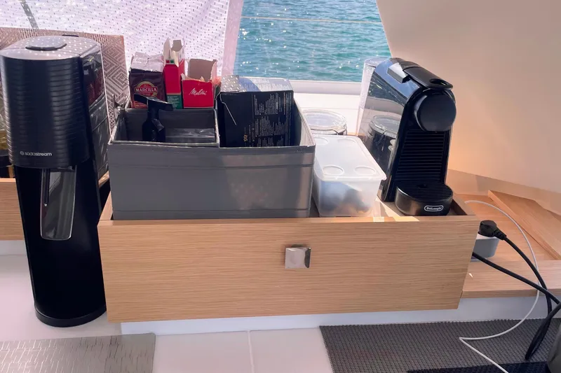 Cabalito De Mar Yacht Photos Pics Coffee station on 2024 Fountaine Pajot Catamaran Elba 45 with espresso machine and accessories.