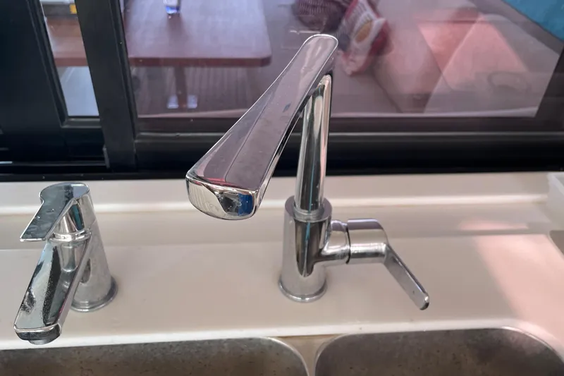 Cabalito De Mar Yacht Photos Pics Modern kitchen faucet on 2024 Fountaine Pajot Catamaran Elba 45, sleek chrome design.