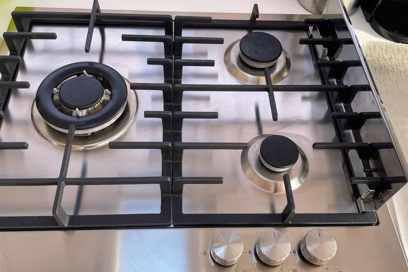 Cabalito De Mar Yacht Photos Pics Stainless steel gas stove with three burners on a 2024 Fountaine Pajot Catamaran Elba 45.