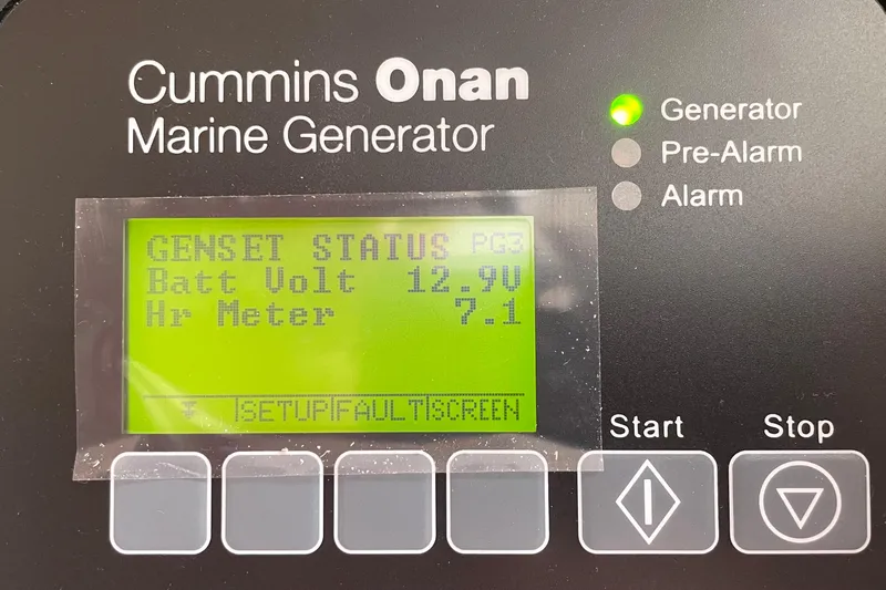 Cabalito De Mar Yacht Photos Pics Cummins Onan marine generator display showing battery voltage and hour meter on Fountaine Pajot Catamaran Elba 45.