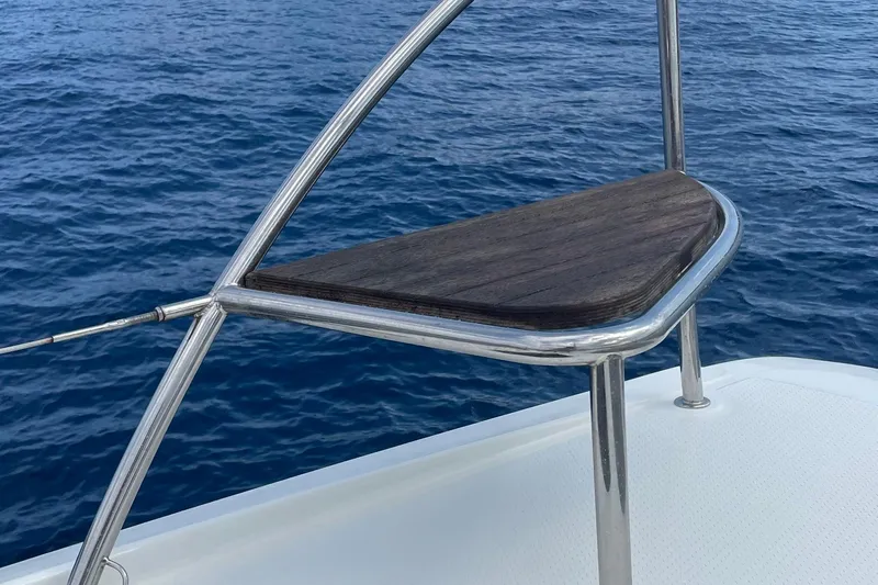 Cabalito De Mar Yacht Photos Pics Stainless steel and wood detail on 2024 Fountaine Pajot Catamaran Elba 45, with ocean backdrop.