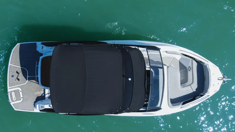  Yacht Photos Pics 2025 NX Boats NX260 EVOLUTION, aerial view, sleek design on turquoise water.