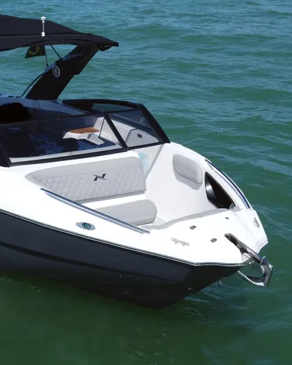  Yacht Photos Pics 2025 NX Boats NX260 EVOLUTION on water, sleek design, luxury seating, modern aesthetics.