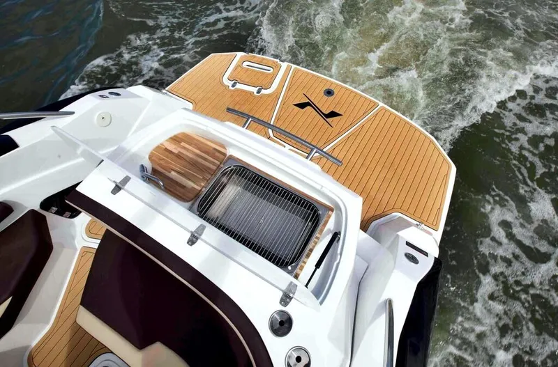  Yacht Photos Pics 2025 NX Boats NX260 EVOLUTION, elegant deck design, cruising on water.