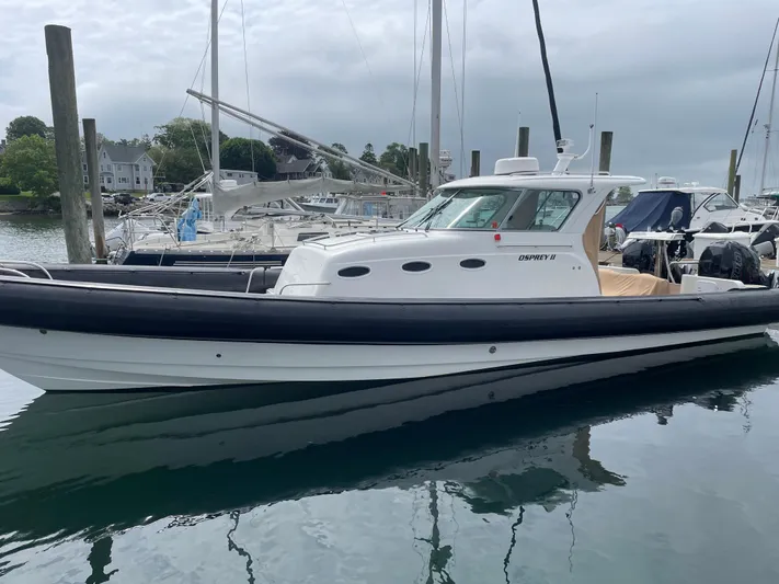  Yacht Photos Pics 2018 Protector Tauranga 38 boat docked in a marina, featuring sleek design and modern amenities.