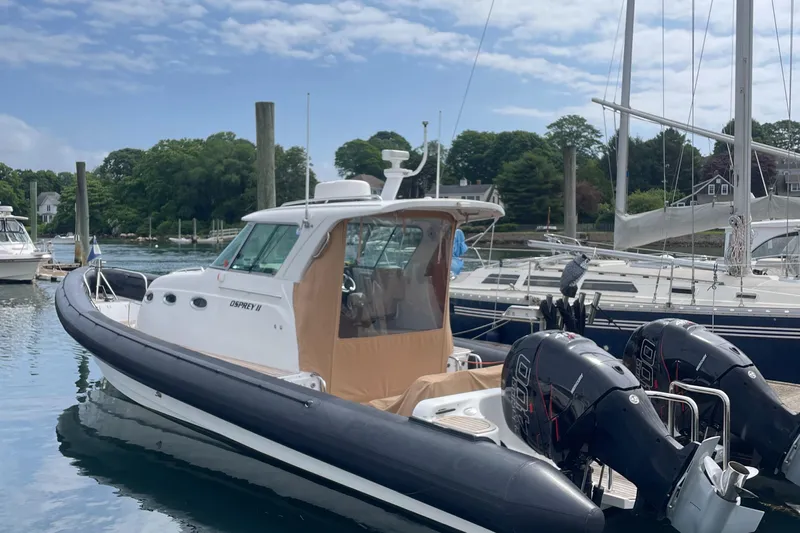  Yacht Photos Pics 2018 Protector Tauranga 38 boat docked with twin outboard engines.