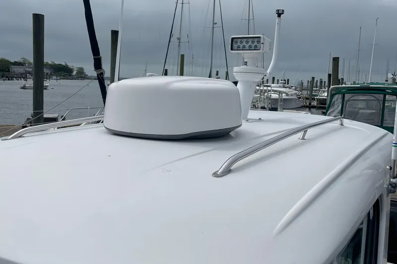  Yacht Photos Pics 2018 Protector Tauranga 38 boat roof with radar and antenna at marina.