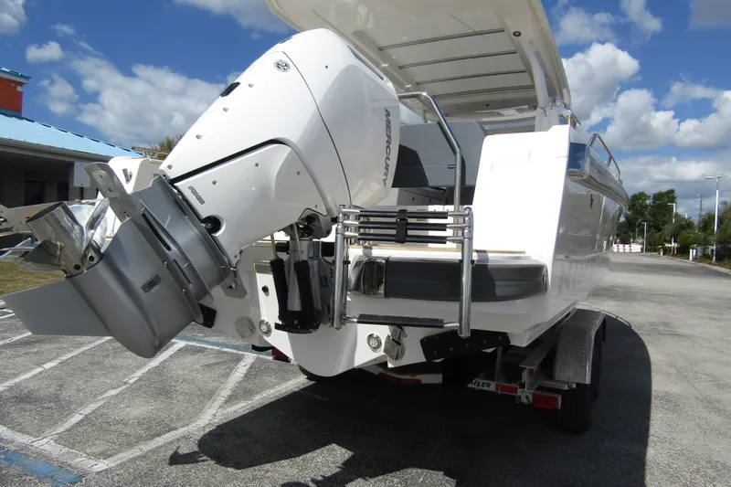  Yacht Photos Pics 2025 Nimbus Weekender 9 boat on trailer, featuring Mercury outboard motor.