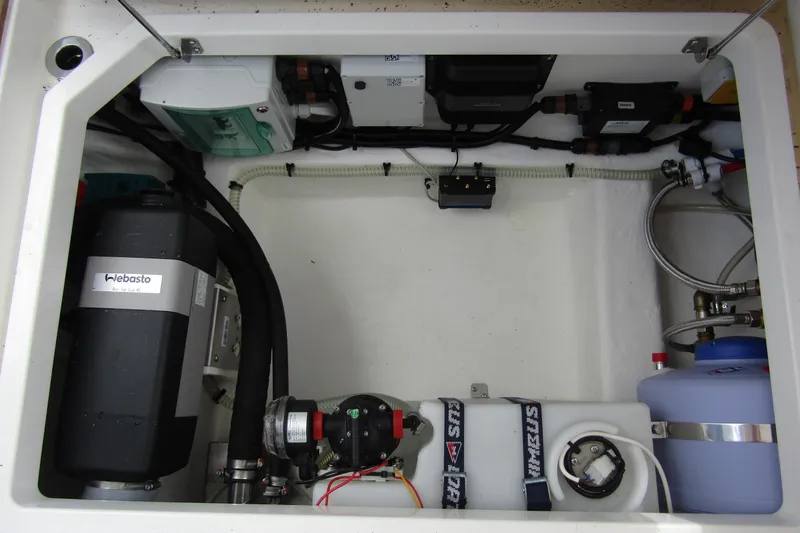 Yacht Photos Pics Engine compartment of 2025 Nimbus Weekender 9, featuring Webasto heater and various mechanical components.