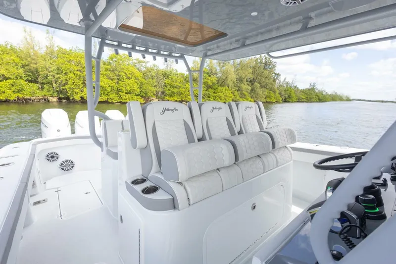  Yacht Photos Pics 2026 Yellowfin 42 Offshore boat interior with luxurious seating and modern controls.