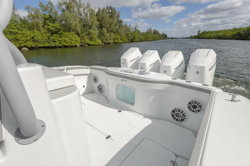  Yacht Photos Pics 2026 Yellowfin 42 Offshore boat with powerful Mercury engines on a scenic river.