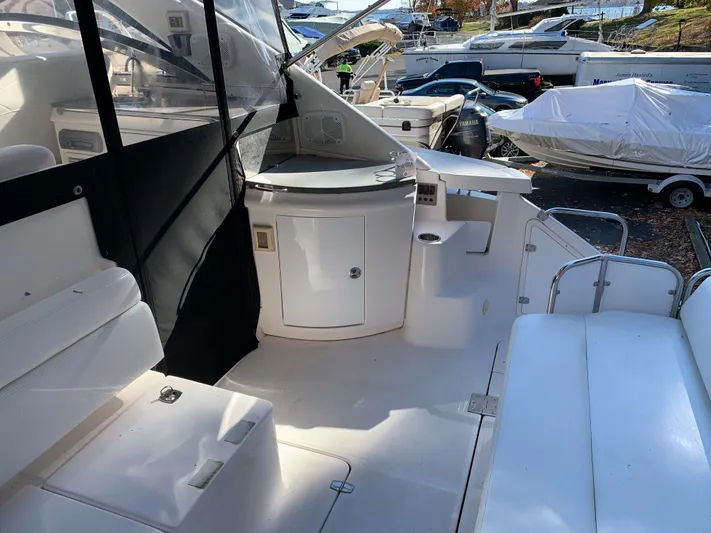  Yacht Photos Pics 2009 Regal 4460 yacht interior with white seating and storage compartments.