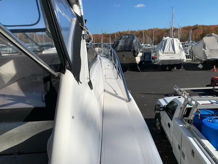  Yacht Photos Pics 2009 Regal 4460 yacht docked in a marina with other boats.