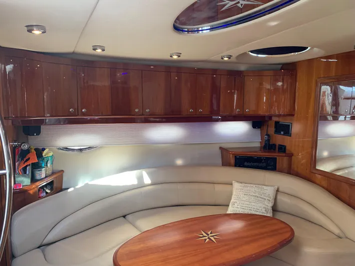  Yacht Photos Pics Luxurious interior of a 2009 Regal 4460 yacht with leather seating and wooden cabinetry.