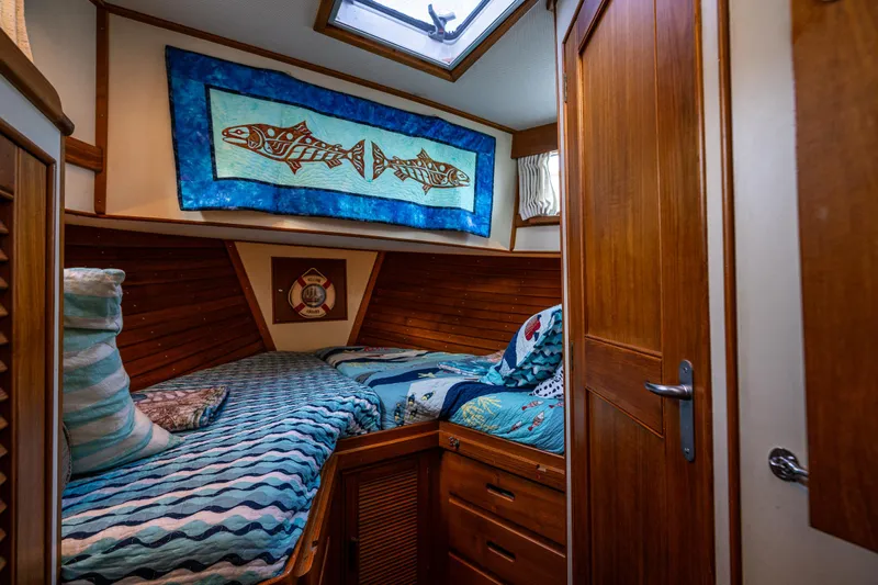 Voyageur Yacht Photos Pics Cozy cabin interior of 1995 Grand Banks Aft Cabin 42 Classic yacht with twin beds.